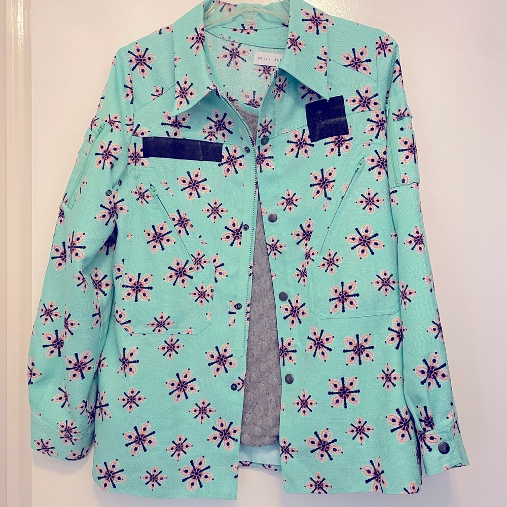 Mint set with asymmetrical mini skirt and jacket size small 4 6